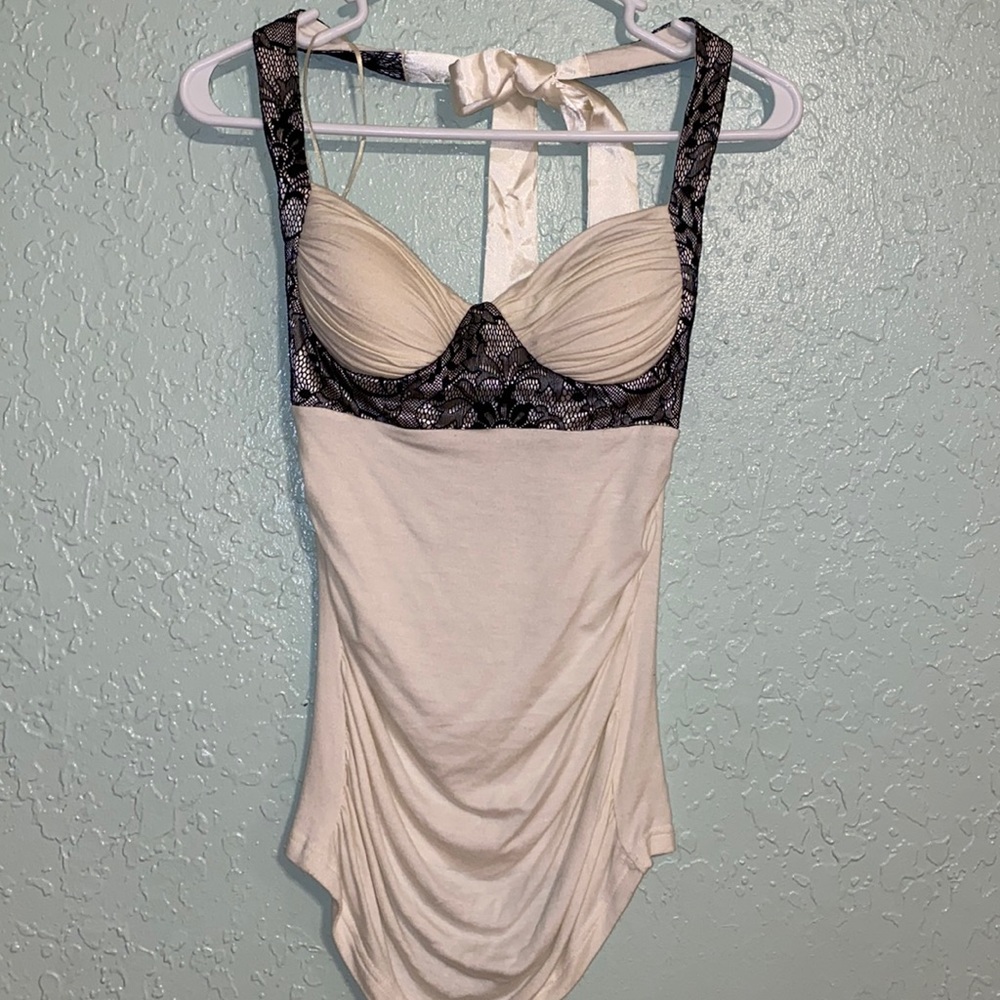 Small Charlotte Russe ivory halter top with black lace detail $12